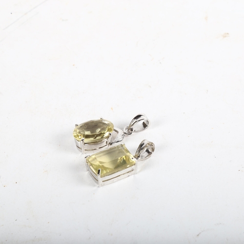 1063 - 2 faceted-cut citrines in silvered mounts