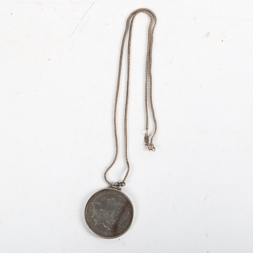 1094 - An 1884 American silver dollar and chain, chain marked 835