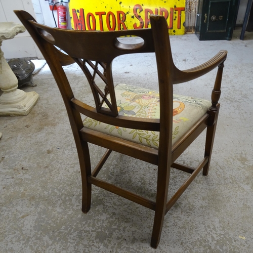 2706 - An early 20th century mahogany open arm chair, with carved and fluted decoration, on square tapered ... 