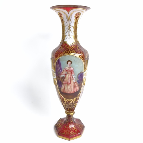 31 - A 19th century Bohemian cranberry glass portrait vase, allover gilded and white enamelled decoration... 