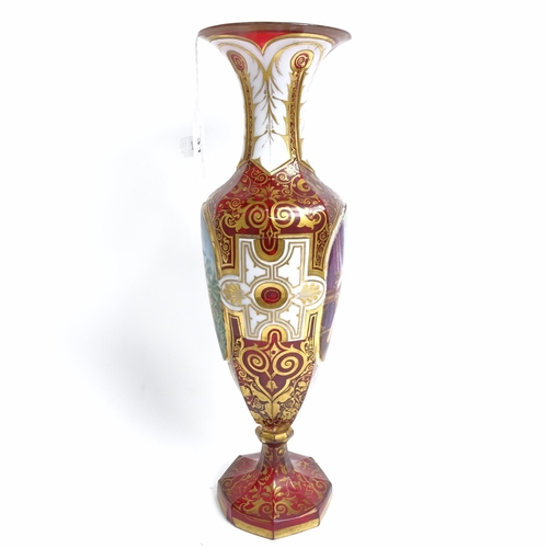 31 - A 19th century Bohemian cranberry glass portrait vase, allover gilded and white enamelled decoration... 