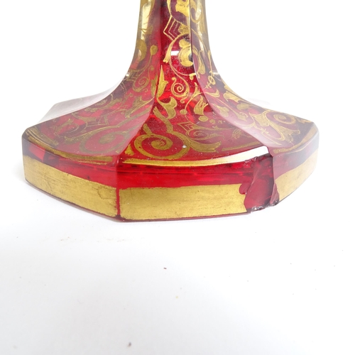 31 - A 19th century Bohemian cranberry glass portrait vase, allover gilded and white enamelled decoration... 