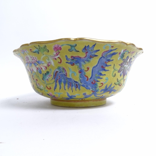 204 - A Chinese famille rose bowl, with flared lobed rim, on turned foot, with mystical beast design, diam... 