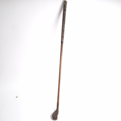 644 - A quantity of Vintage golf clubs and walking sticks, including thumb stick with various commemorativ... 