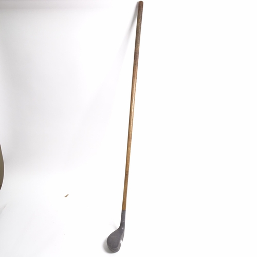 644 - A quantity of Vintage golf clubs and walking sticks, including thumb stick with various commemorativ... 