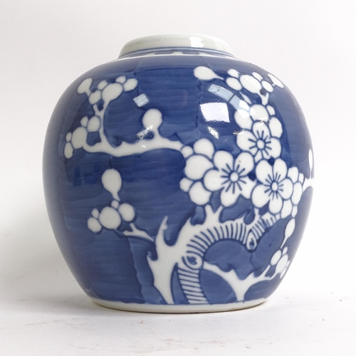 209 - 3 Chinese blue and white ginger jar and covers, all prunus decorated, on stands, 1 lacking its lid, ... 