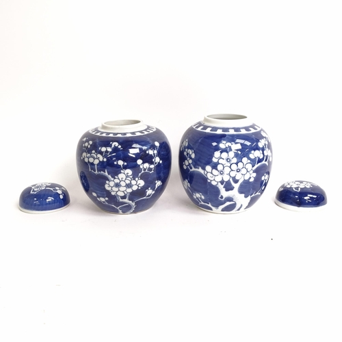 209 - 3 Chinese blue and white ginger jar and covers, all prunus decorated, on stands, 1 lacking its lid, ... 