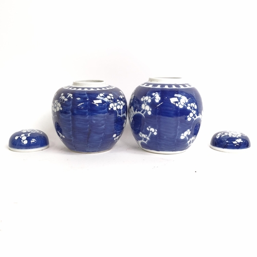 209 - 3 Chinese blue and white ginger jar and covers, all prunus decorated, on stands, 1 lacking its lid, ... 