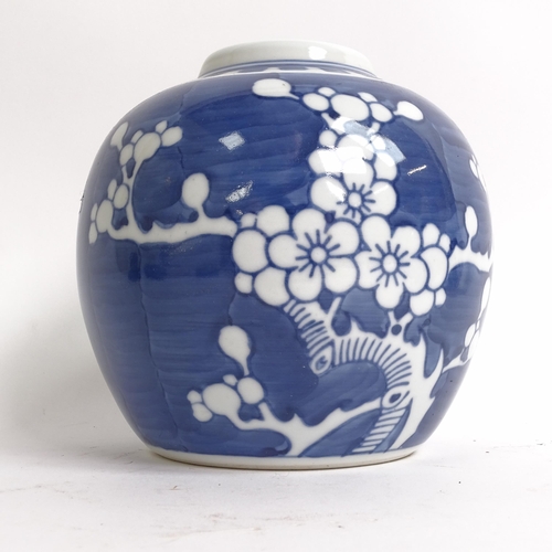 209 - 3 Chinese blue and white ginger jar and covers, all prunus decorated, on stands, 1 lacking its lid, ... 