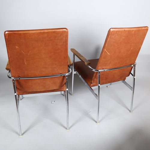 48 - A pair of 1960s' American Pace chairs by Simmons, with oak armrest on tubular steel, brown leather u... 