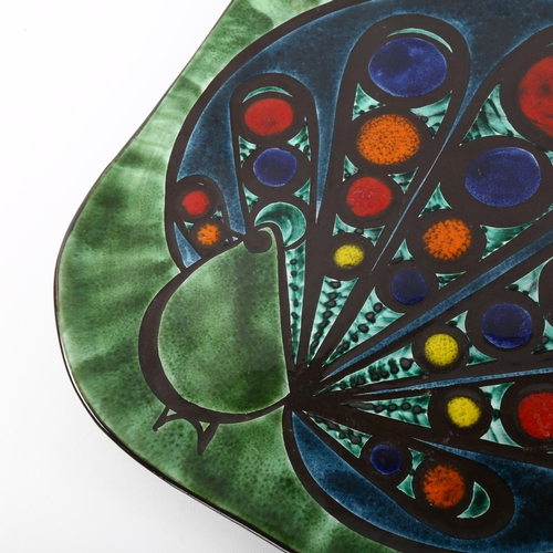 8 - BURKART HANDARBEIT, a 1960/70s' peacock design wall hanging charger, signed on reverse, 38cm sq