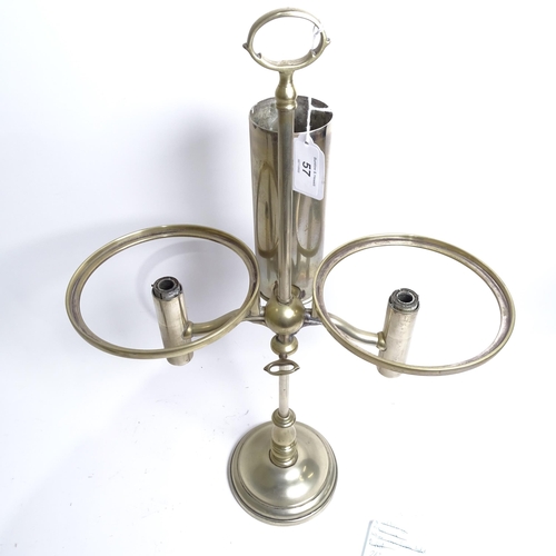 57 - MILLER & SONS PICADILLY - a polished brass double adjustable student's oil lamp, with green glass sh... 