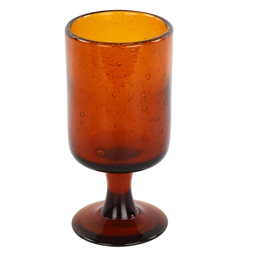 103 - ERIK HOGLUND for Boda, Sweden, a 1950s' Red/Amber goblet with seeded air bubbles, height 17cm