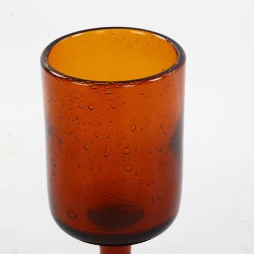 103 - ERIK HOGLUND for Boda, Sweden, a 1950s' Red/Amber goblet with seeded air bubbles, height 17cm