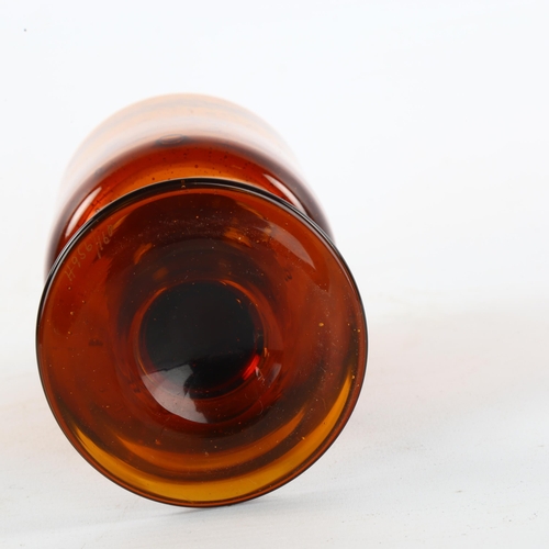 103 - ERIK HOGLUND for Boda, Sweden, a 1950s' Red/Amber goblet with seeded air bubbles, height 17cm