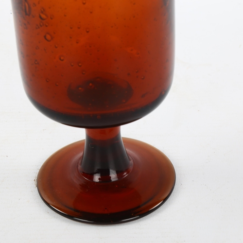 103 - ERIK HOGLUND for Boda, Sweden, a 1950s' Red/Amber goblet with seeded air bubbles, height 17cm