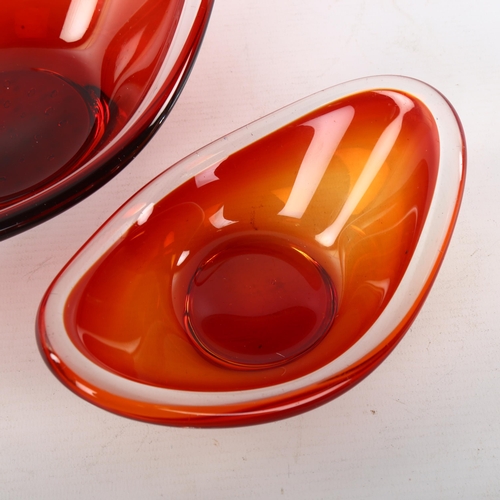 177 - A graduated pair of Swedish glass oval form bowls, partial sticker to largest bowl, length 27.5cm