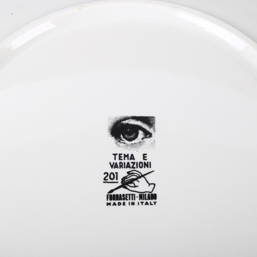 64 - A FORNASETTI plate, model 201, makers stamp to back, diameter 26.5cm