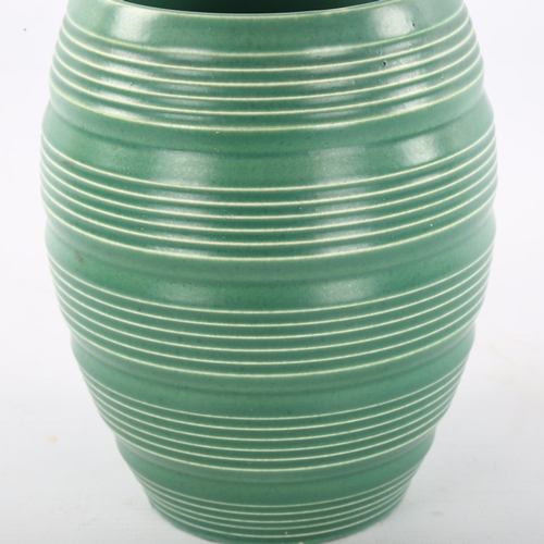 86 - KEITH MURRAY for Wedgwood, a 1930s' ribbed vase in Matt Green, makers marks to base, height 17.5cm