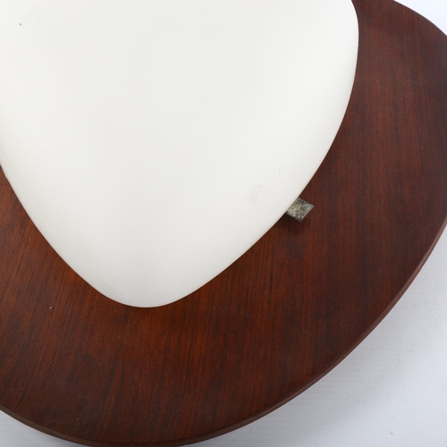 91 - GOFFREDO REGGIANI, a 1960s' design wall light, frosted glass on teak ply back board, diameter 40cm