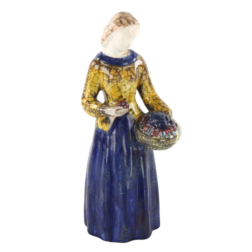 98 - MARIANNE STARCK for Michael Andersen, a Danish pottery figurine of a woman holding a basket of fruit... 