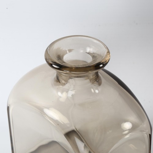 145 - A 1930s' decanter by Strombergshyttan, Sweden, smoked glass with black stopper, height 17cm