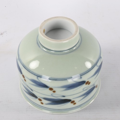 162 - DEREK CLARKSON, a studio pottery porcelain tea bowl, with celadon, cobalt and iron glaze, maker stam... 