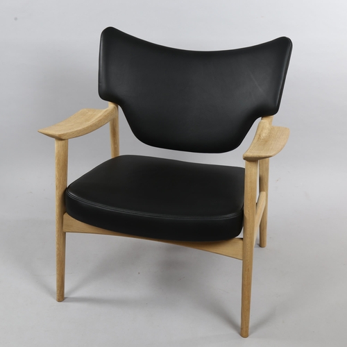 100 - A Scandinavian Veng lounge chair in black leather and soaped oak by TORBJORN BEKKEN designed 1960 fo... 