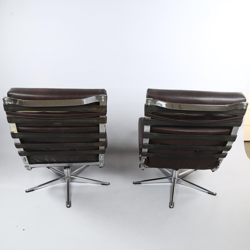 124 - A pair of mid-century chromed steel swivel armchairs, faux leather upholstery, no makers marks, heig... 