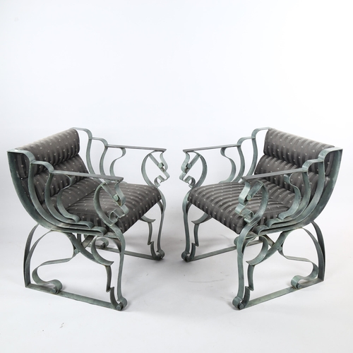 156 - A pair of post-modern wrought iron armchairs, with Verdigris patinated frame in winged horse form, h... 
