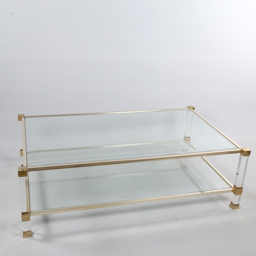 168 - A Pierre Vandel Lucite and glass two-tier coffee table,  128cm wide 78cm deep 40.5cm high