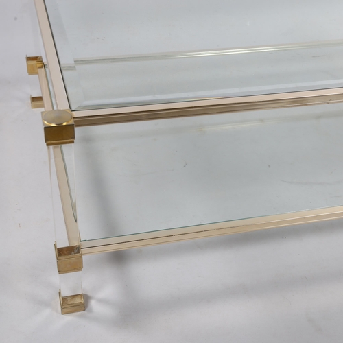 168 - A Pierre Vandel Lucite and glass two-tier coffee table,  128cm wide 78cm deep 40.5cm high