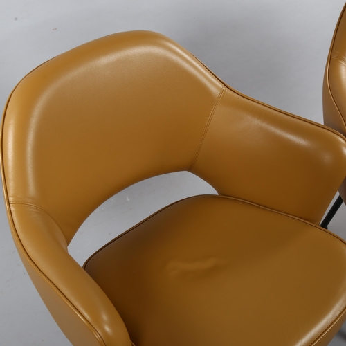 17 - EERO SAARINEN, a pair of Knoll Executive armchairs in tan leather with impressed Knoll Studio to leg... 