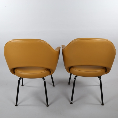 17 - EERO SAARINEN, a pair of Knoll Executive armchairs in tan leather with impressed Knoll Studio to leg... 