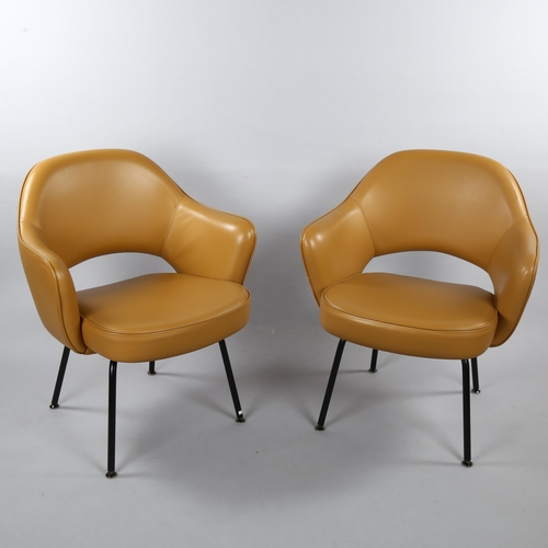 18 - EERO SAARINEN, a pair of Knoll Executive armchairs in tan leather with impressed Knoll Studio to leg... 