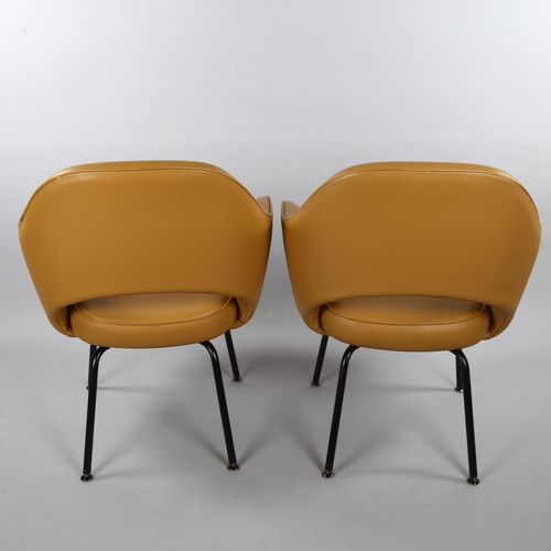 18 - EERO SAARINEN, a pair of Knoll Executive armchairs in tan leather with impressed Knoll Studio to leg... 