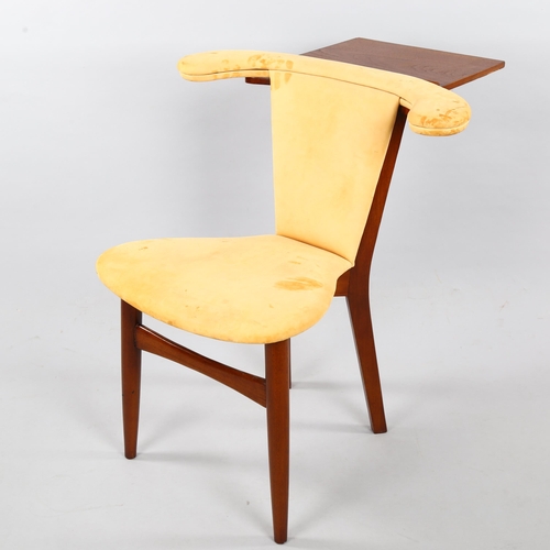 29 - A mid-century teak reading chair, with book stand and natural suede upholstery, height 76cm