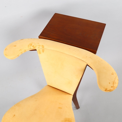 29 - A mid-century teak reading chair, with book stand and natural suede upholstery, height 76cm