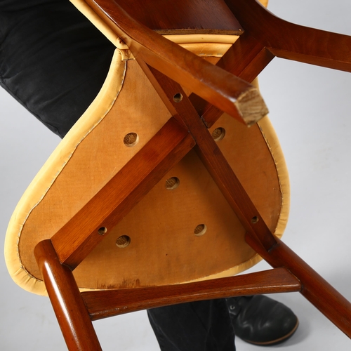 29 - A mid-century teak reading chair, with book stand and natural suede upholstery, height 76cm