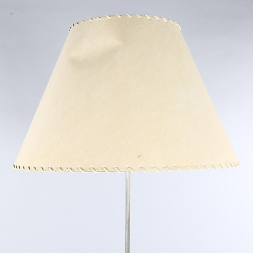 30 - A 1950s' steel standard lamp, in the manner of ERNEST RACE, with Skylon style base, later parchment ... 