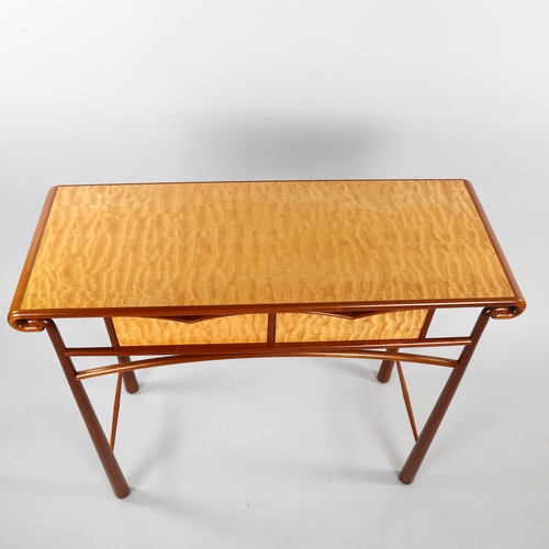 36 - ANDREW VARAH (1944-2012), a craftsman made console table in quilted maple and walnut, circa 1990, wi... 