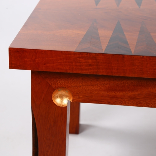 49 - MARK BEVERTON, a contemporary craftsman made coffee table with inlaid Backgammon board, with sculptu... 