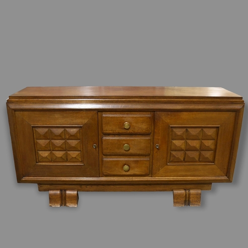 74 - CHARLES DUDOUYT, a 1940s' oak sideboard, 3 central drawers and 2 shelved cupboards, 190 x 50cm, heig... 