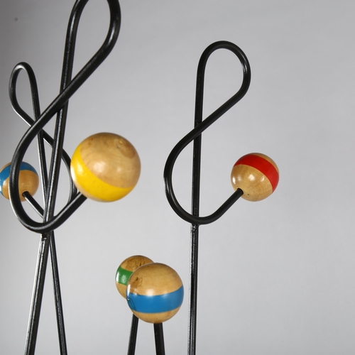 96 - ROGER FERAUD, (1890-1964), a Cle De Sol coat stand, steel frame with wood ball ends, height 178cm