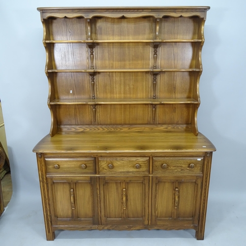 2004 - An Ercol elm 2-section dresser, with 3 fitted drawers and cupboards under, with maker's label, 145cm... 