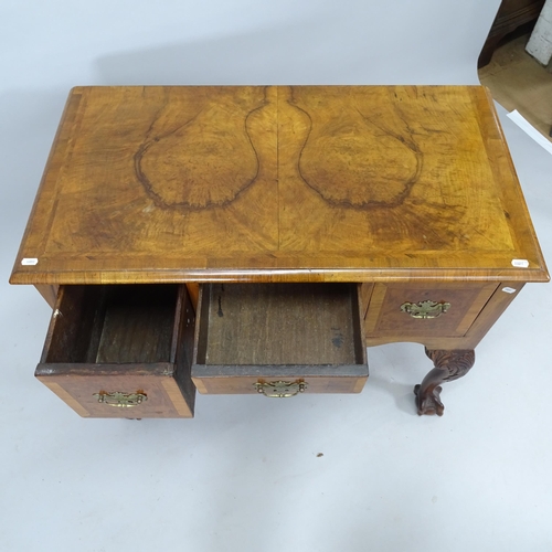 2009 - An Antique crossbanded walnut lowboy, with 3 fitted drawers, on mahogany cabriole legs with claw and... 