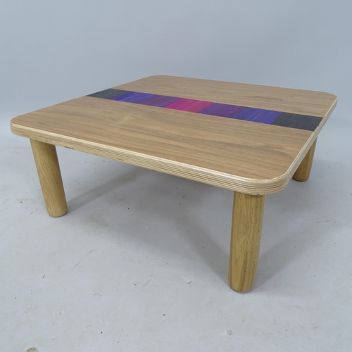 2011 - IAIN GLYNN, a low walnut veneer ply coffee table with straw work inserts, signed under top, H 25cm x... 