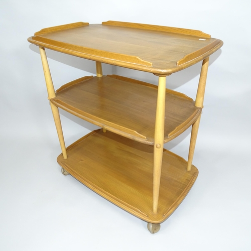 2002 - A mid-century Ercol elm 3-tier trolley, 72cm x 77cm x 46cm