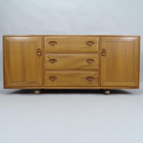 2003 - A mid-century Ercol Windsor elm sideboard, with 3 frieze drawers and panelled cupboards, 155cm x 69c... 