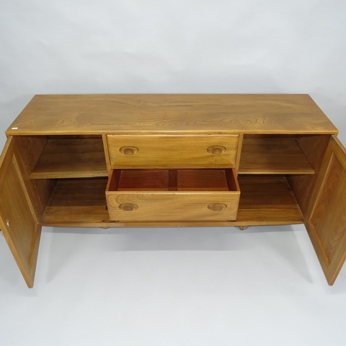 2003 - A mid-century Ercol Windsor elm sideboard, with 3 frieze drawers and panelled cupboards, 155cm x 69c... 